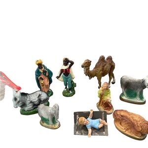 Manger 9 assorted pieces including a baby Jesus. Cow, donkey